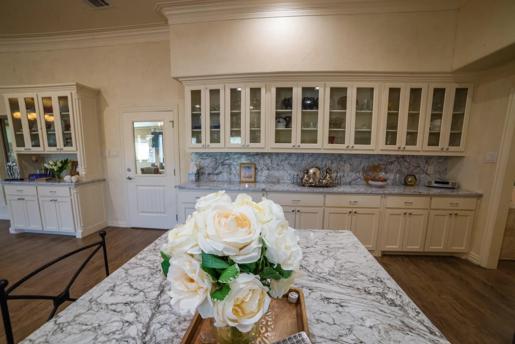 Glass-front display cabinets and butler's pantry